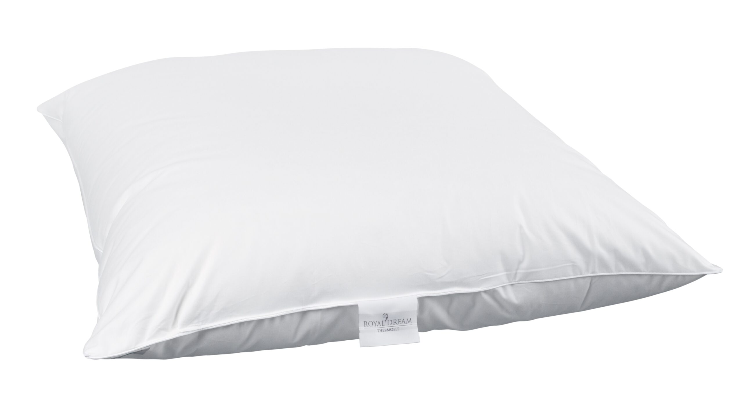 Ein weißes Kissen mit einem Etikett mit der Aufschrift "Royal Dream Thermofill" an der Kante.